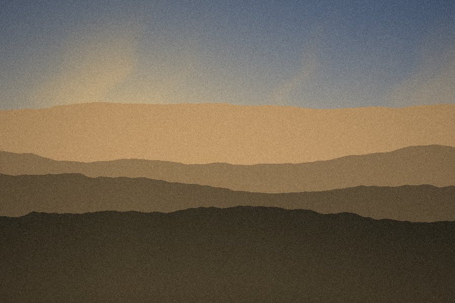 Ochre ridgelines fading into warm evening haze
